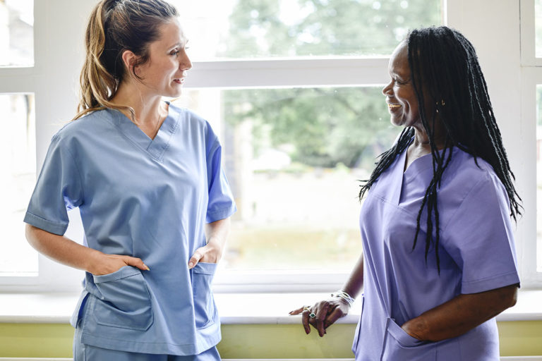nurse being mentored by more experienced nurse