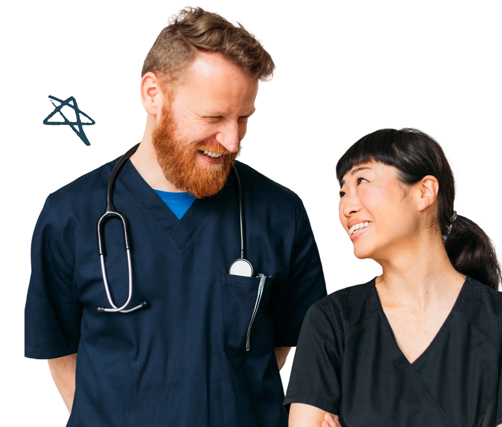 A male and a female healthcare worker in dark scrubs smile at each other, appearing happy and relaxed—perhaps thanks to efficient nurse scheduling software.